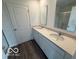 Modern bathroom with dual sinks, white cabinets, and a glass-enclosed shower at 7549 Big Bend Blvd, Camby, IN 46113