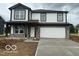 Charming two-story home with stone accents, a two-car garage, and a well-manicured lawn at 7549 Big Bend Blvd, Camby, IN 46113