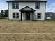 Charming two-story home with a welcoming porch and lush lawn at 7549 Big Bend Blvd, Camby, IN 46113