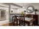 Dining room with a stainless refrigerator and white cabinetry at 8336 Woodall Dr # Kr, Indianapolis, IN 46268