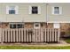 Attractive townhouse exterior with fenced yard, a mix of siding and brick, showcasing a well-maintained property at 8336 Woodall Dr # Kr, Indianapolis, IN 46268