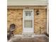 Charming front entrance with a secure door, stylish light fixture, and a welcoming doormat enhancing curb appeal at 8336 Woodall Dr # Kr, Indianapolis, IN 46268