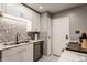 Well-lit kitchen with modern appliances, white cabinetry, and decorative backsplash at 8336 Woodall Dr # Kr, Indianapolis, IN 46268