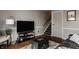 Comfortable living room featuring hardwood floors, a flat-screen TV, and cozy decor at 8336 Woodall Dr # Kr, Indianapolis, IN 46268