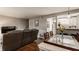 Cozy living space with a modern entertainment setup and dining area access at 8336 Woodall Dr # Kr, Indianapolis, IN 46268