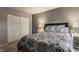 Calm bedroom with large bed, closet doors and soft, natural lighting at 8336 Woodall Dr # Kr, Indianapolis, IN 46268
