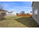 A spacious backyard with a wooden fence, offering privacy and a large area for outdoor activities at 8926 Poppy Ln, Indianapolis, IN 46231