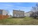 Spacious backyard featuring a well-maintained lawn and a two-story home with vinyl siding at 8926 Poppy Ln, Indianapolis, IN 46231