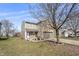Well-maintained two-story home with a mix of brick and siding, a driveway, and a simple lawn at 8926 Poppy Ln, Indianapolis, IN 46231