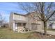 Charming home with a two-car garage, complemented by flower beds and a well-manicured lawn at 8926 Poppy Ln, Indianapolis, IN 46231