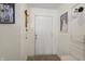 Inviting hallway with white walls, accented by tasteful decorations and warm, modern lighting at 8926 Poppy Ln, Indianapolis, IN 46231