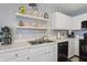 Features a well-maintained sink and countertop with modern appliances and a view of stylish decor at 8926 Poppy Ln, Indianapolis, IN 46231