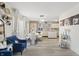 Bright, open-concept living area with a dining table and a view into the modern kitchen at 8926 Poppy Ln, Indianapolis, IN 46231