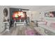 Spacious living room with an open layout, featuring a large TV and comfortable seating at 8926 Poppy Ln, Indianapolis, IN 46231