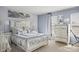 A serene bedroom showcasing a luxurious bed, complemented by stylish décor and plenty of natural light at 8926 Poppy Ln, Indianapolis, IN 46231