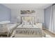 Elegant main bedroom featuring a luxurious bed, matching nightstands, and a cozy crib for added convenience at 8926 Poppy Ln, Indianapolis, IN 46231