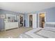 Spacious main bedroom showcasing ample closet and ensuite bathroom access with neutral walls and carpeting at 8926 Poppy Ln, Indianapolis, IN 46231