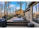 Spacious back deck with hot tub, grill, and scenic wooded views perfect for outdoor relaxation and entertaining at 9334 Seascape Dr, Indianapolis, IN 46256