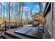 Inviting back deck with hot tub and comfortable seating offering a peaceful retreat with serene views of surrounding trees at 9334 Seascape Dr, Indianapolis, IN 46256