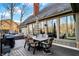 Sprawling back deck with dining set and view from inside offers a seamless transition from indoor to outdoor living and entertaining at 9334 Seascape Dr, Indianapolis, IN 46256