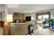 Open basement area with a fireplace, TV area, and easy outdoor access through sliding glass doors at 9334 Seascape Dr, Indianapolis, IN 46256