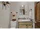 Elegant powder room featuring a stylish vanity, square mirror, and decorative accents creating a refined space at 9334 Seascape Dr, Indianapolis, IN 46256