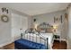 Bright bedroom featuring a metal bed frame, wood floors, and double closets at 9334 Seascape Dr, Indianapolis, IN 46256