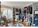 Spacious walk-in closet featuring custom shelving, seating, and ample storage space at 9334 Seascape Dr, Indianapolis, IN 46256