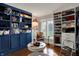 Organized walk-in closet featuring custom shelving, shoe storage, and ample cabinet space at 9334 Seascape Dr, Indianapolis, IN 46256