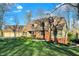Charming brick home boasting lush lawn, manicured landscaping, and a welcoming front facade at 9334 Seascape Dr, Indianapolis, IN 46256