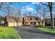 Charming brick home featuring a two-car garage, brick walkway, and beautifully landscaped front yard at 9334 Seascape Dr, Indianapolis, IN 46256