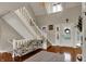 Bright foyer featuring high ceilings, grand staircase, and stylish accents at 9334 Seascape Dr, Indianapolis, IN 46256