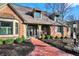 Inviting brick home entrance featuring a brick path, front bench, and charming exterior details at 9334 Seascape Dr, Indianapolis, IN 46256