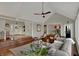 Bright and airy living room featuring hardwood floors, vaulted ceilings, and a cozy seating area at 9334 Seascape Dr, Indianapolis, IN 46256