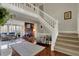 Bright living area featuring hardwood floors, brick fireplace, and a cozy seating area at 9334 Seascape Dr, Indianapolis, IN 46256