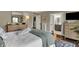 Bright main bedroom providing a view into the bathroom and featuring a walk-out balcony at 9334 Seascape Dr, Indianapolis, IN 46256