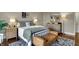 Well-lit main bedroom with a decorative rug, warm lamps, and stylish furniture at 9334 Seascape Dr, Indianapolis, IN 46256