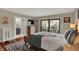 Spacious main bedroom with access to a balcony and a view into an en-suite bathroom at 9334 Seascape Dr, Indianapolis, IN 46256
