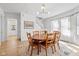 Bright dining room featuring a wooden table with seating for six and large windows at 935 N Tacoma Ave, Indianapolis, IN 46201