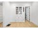 Bright dining room featuring custom built-in display cabinets and a glimpse into the organized pantry at 935 N Tacoma Ave, Indianapolis, IN 46201