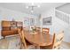 Bright dining room with warm wood furnishings and decor, adjacent to the kitchen at 935 N Tacoma Ave, Indianapolis, IN 46201