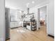 Modern white kitchen featuring sleek appliances, ample counter space, and open access to dining area at 935 N Tacoma Ave, Indianapolis, IN 46201