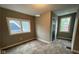 Cozy bedroom with two windows, providing natural light and a pleasant atmosphere at 950 N Rural St, Indianapolis, IN 46201