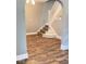 Stylish staircase with hardwood flooring and white banister, blending elegance and functionality at 950 N Rural St, Indianapolis, IN 46201