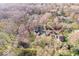 A beautiful aerial view of the home with mature trees and landscaping at 98 Highland Manor S Ct, Indianapolis, IN 46228