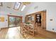 Open dining area with views of the backyard and deck through the sliding glass door at 98 Highland Manor S Ct, Indianapolis, IN 46228
