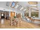 Open concept dining room featuring natural light from skylights and view of the backyard at 98 Highland Manor S Ct, Indianapolis, IN 46228