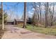 Charming log cabin style home with stone chimney and a driveway at 98 Highland Manor S Ct, Indianapolis, IN 46228