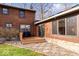 Detailed view of a log cabin home with a wood deck and stone walkway at 98 Highland Manor S Ct, Indianapolis, IN 46228