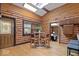 Cozy log cabin kitchen with a breakfast nook and access to the living area at 98 Highland Manor S Ct, Indianapolis, IN 46228